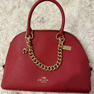 Red NEW never worn Coach bag